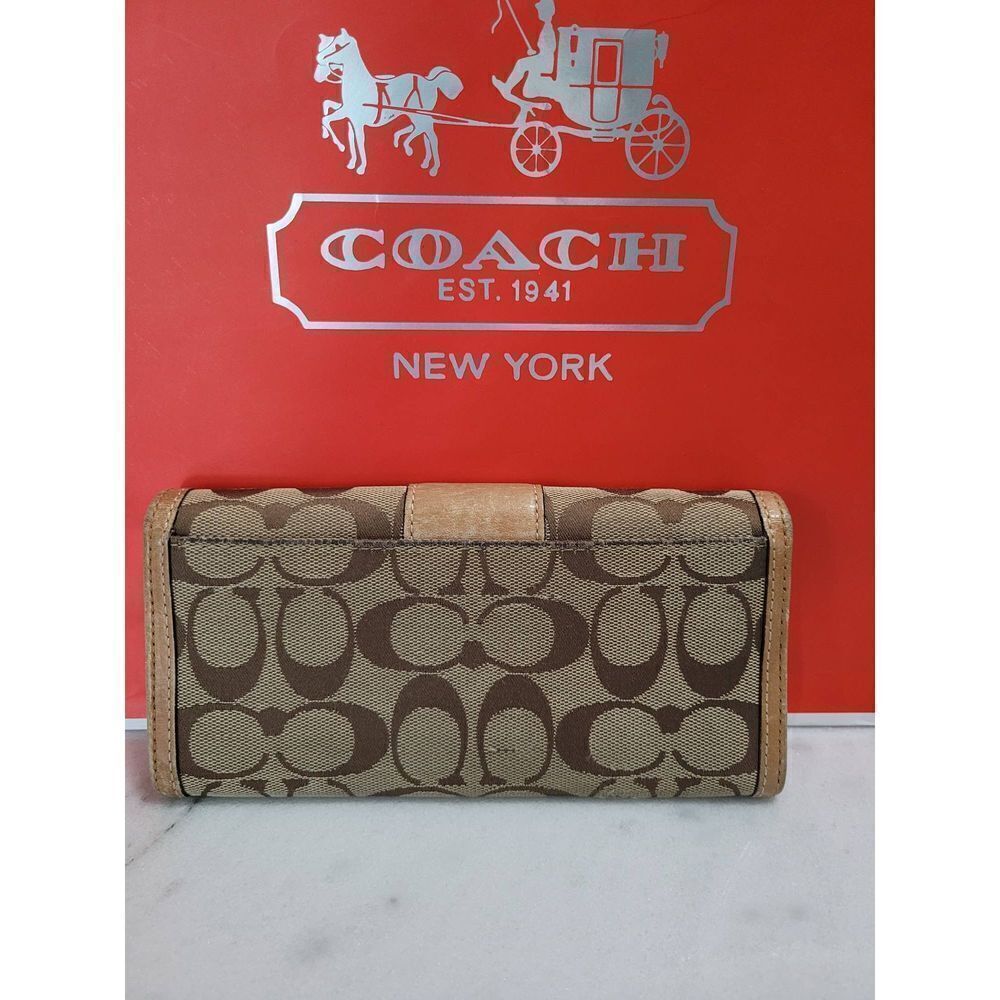 Coach Signature Brown Bifold Wallet.